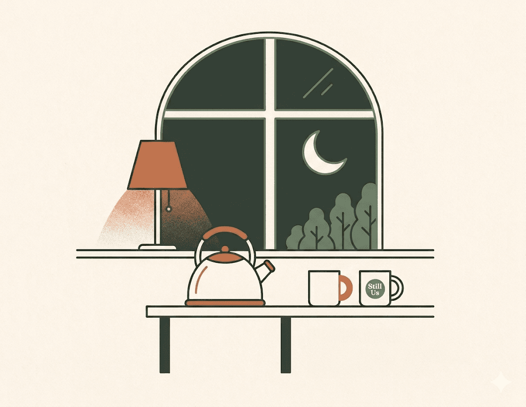 A dark kitchen at night with a kettle, two mugs, a lamp, and a crescent moon in the window